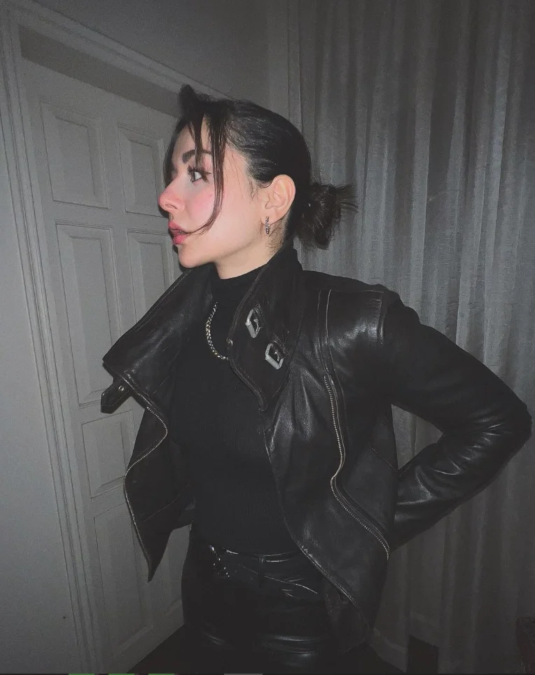 Hania Amir wearing a black jacket