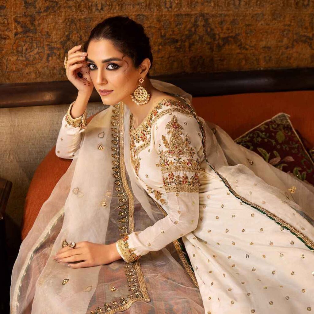 maya ali posing with white dress